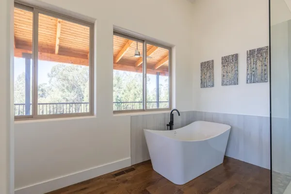 a bathroom with a toilet a sink and a window