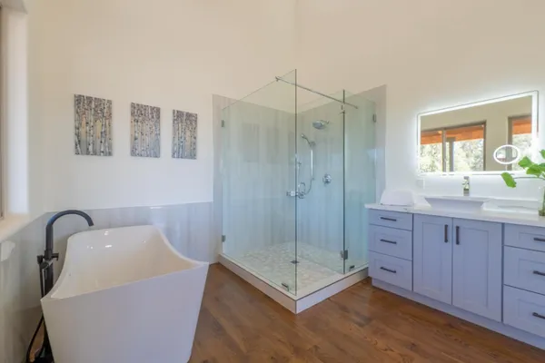 a bathroom with a sink and vanity
