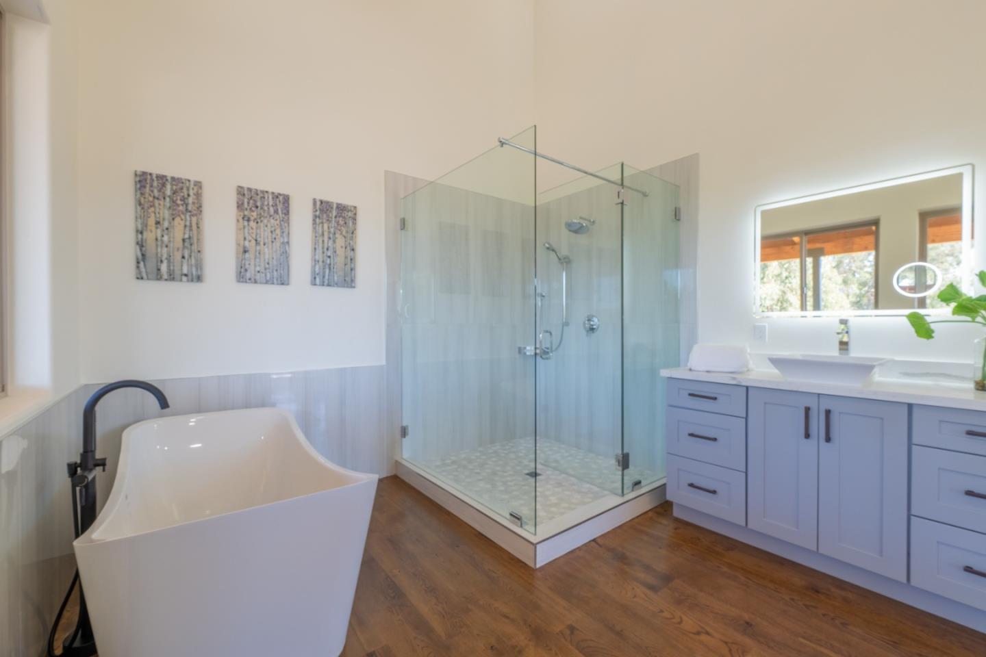 9020 Hidden Canyon Road Salinas, CA 93907 - Photo 42 of 58 a bathroom with a tub shower vanity and a sink