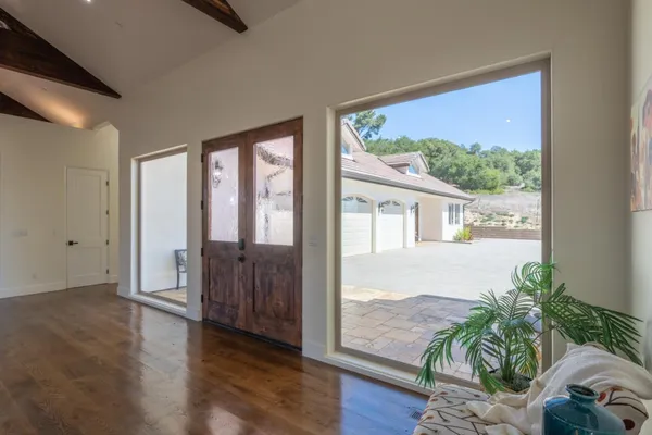 a kitchen with a stove a refrigerator and a dining table