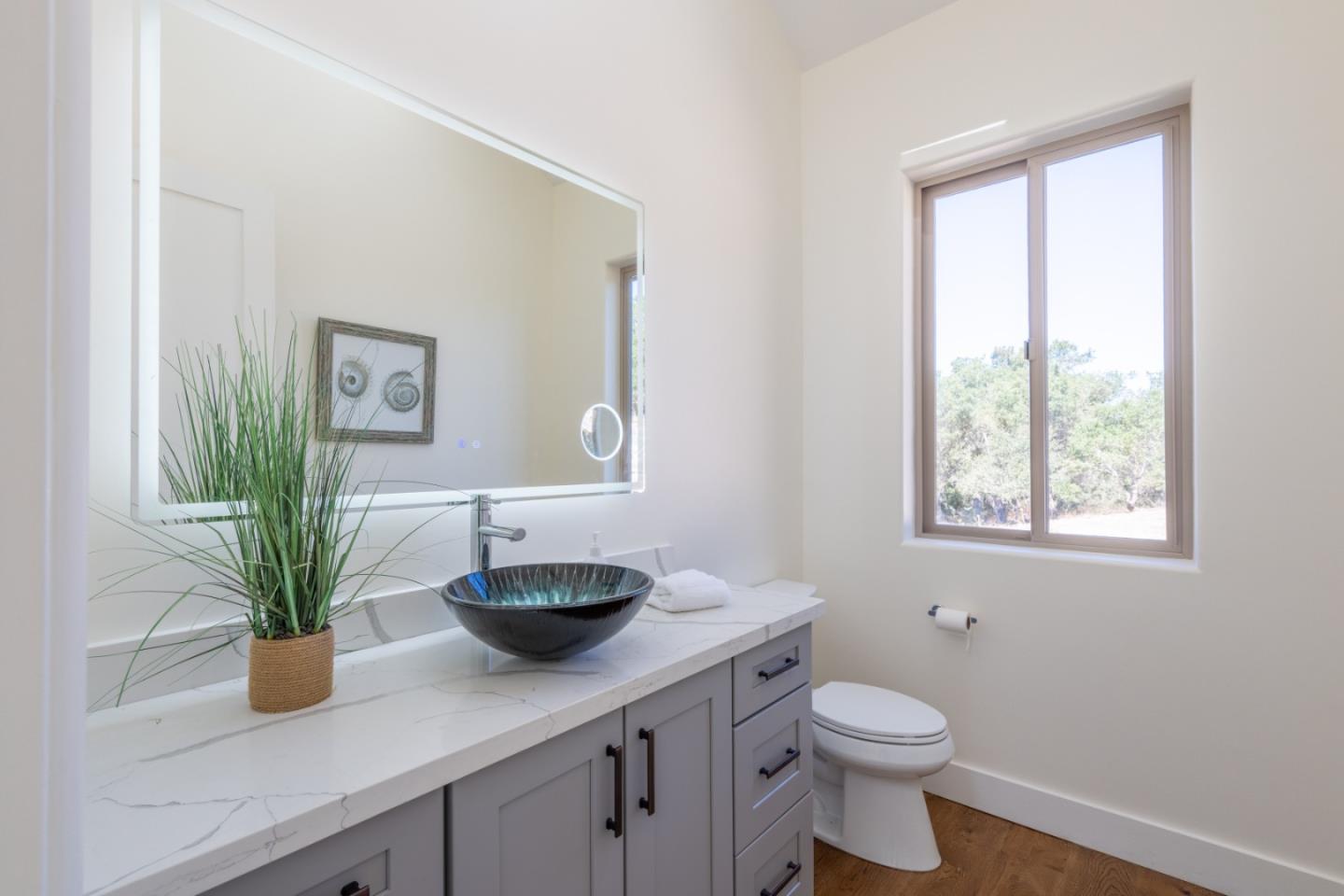 9020 Hidden Canyon Road Salinas, CA 93907 - Photo 47 of 58 a bathroom with a toilet a sink and a window