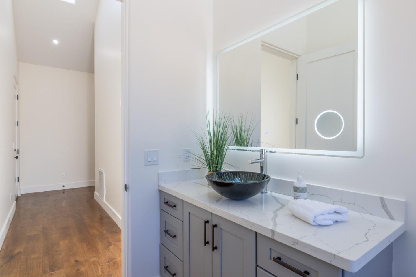 9020 Hidden Canyon Road Salinas, CA 93907 - Photo 48 of 58 a bathroom with a sink and vanity