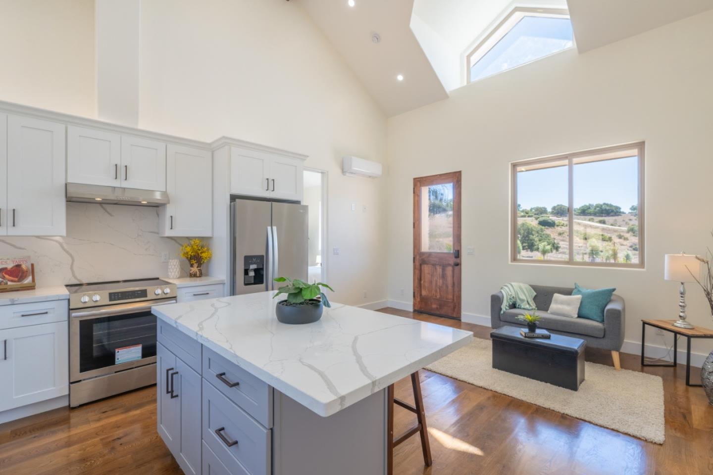 9020 Hidden Canyon Road Salinas, CA 93907 - Photo 52 of 58 a kitchen with a stove a refrigerator and a dining table