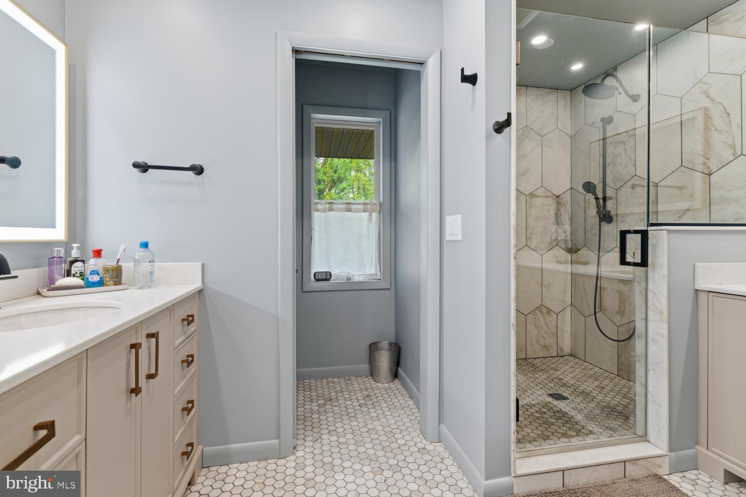 1074 Pheasant Road Rydal, PA 19046 - Photo 33 of 51 a bathroom with a granite countertop sink a mirror and shower