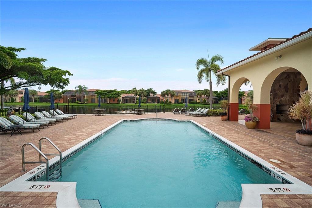 8581 Via Garibaldi Circle, Unit 201 Estero, FL 33928 - Photo 12 of 42 a view of a swimming pool with a patio
