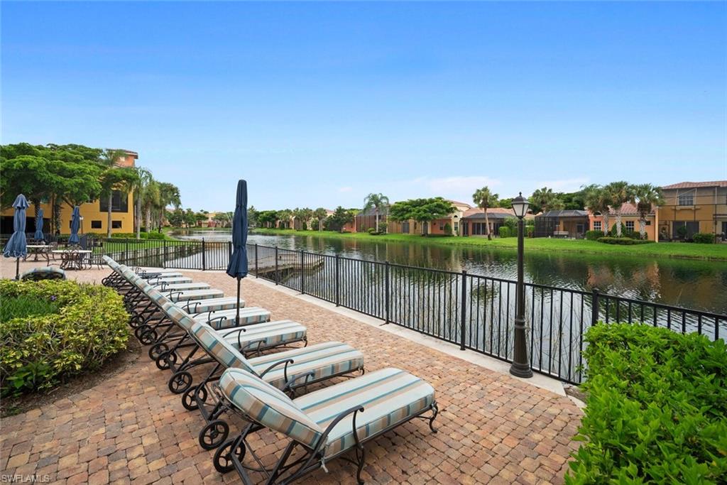 8581 Via Garibaldi Circle, Unit 201 Estero, FL 33928 - Photo 14 of 42 a view of a lake with furniture
