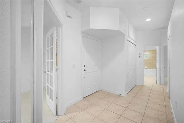 a front view of multiple houses with yard