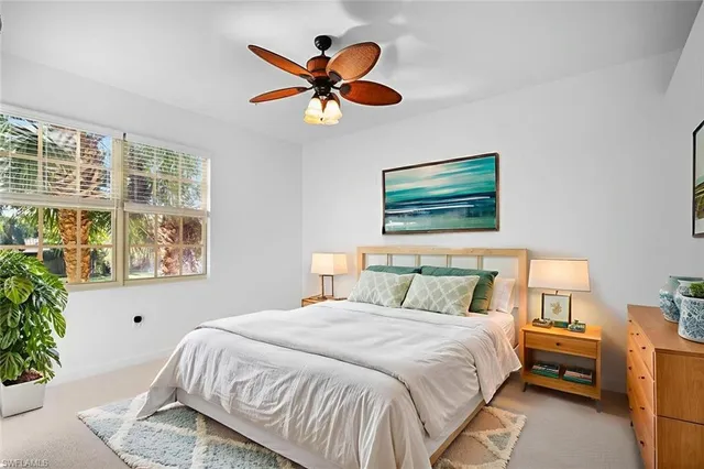 an empty room with a empty space and a ceiling fan