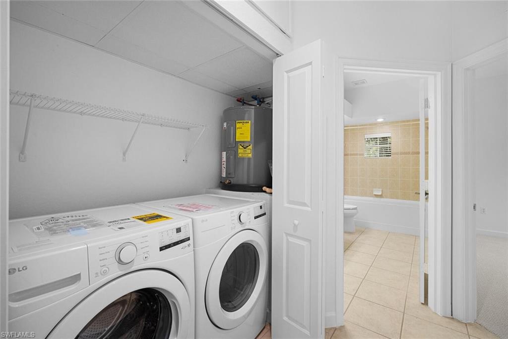 8581 Via Garibaldi Circle, Unit 201 Estero, FL 33928 - Photo 33 of 42 a utility room with dryer and washer