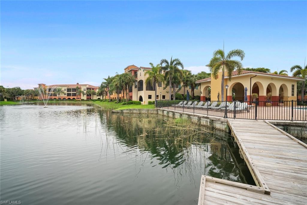 8581 Via Garibaldi Circle, Unit 201 Estero, FL 33928 - Photo 10 of 42 a view of a lake with houses