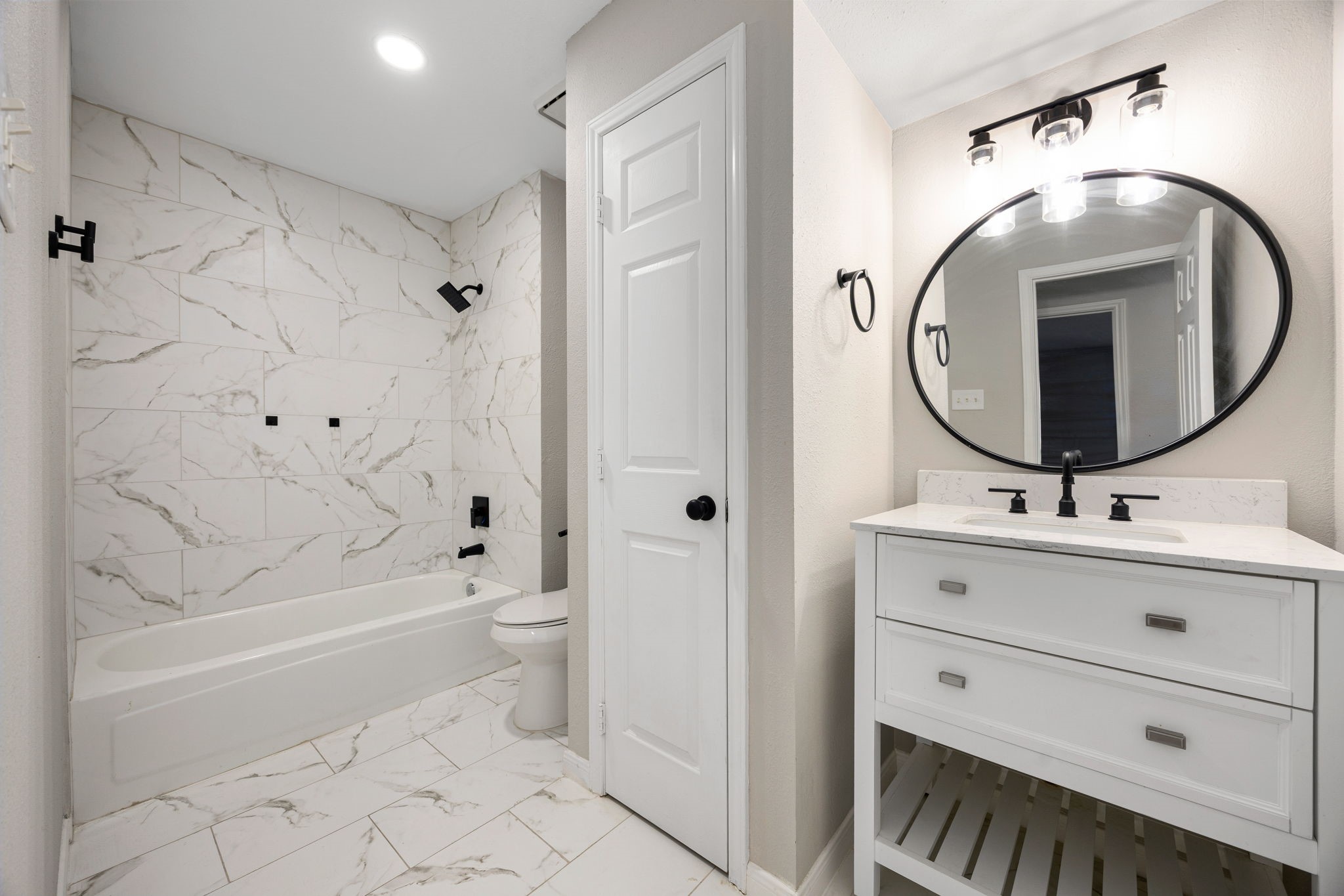 16919 Chapel Pines Drive, Unit 128 Spring, TX 77379 - Photo 17 of 24 This updated bathroom showcases a clean, modern design with a walk-in shower, sleek finishes, and a functional layout that blends style with everyday convenience.