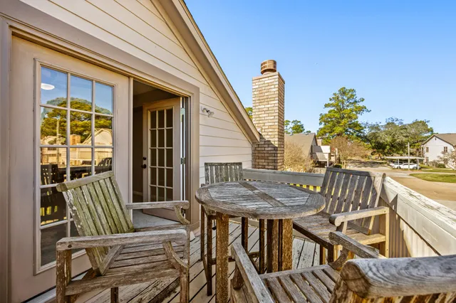 a view of a balcony with furniture