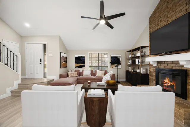 a living room with furniture and a flat screen tv