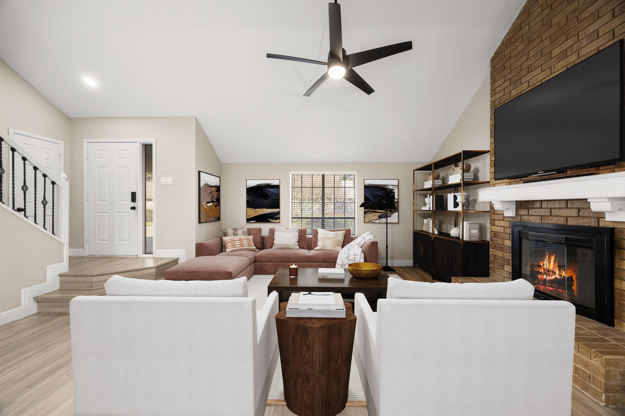 16919 Chapel Pines Drive, Unit 128 Spring, TX 77379 - Photo 6 of 24 This bright, open-concept living space features soaring ceilings, abundant natural light, and seamless flow between the kitchen, dining, and living areas, ideal for both everyday living and entertaining.