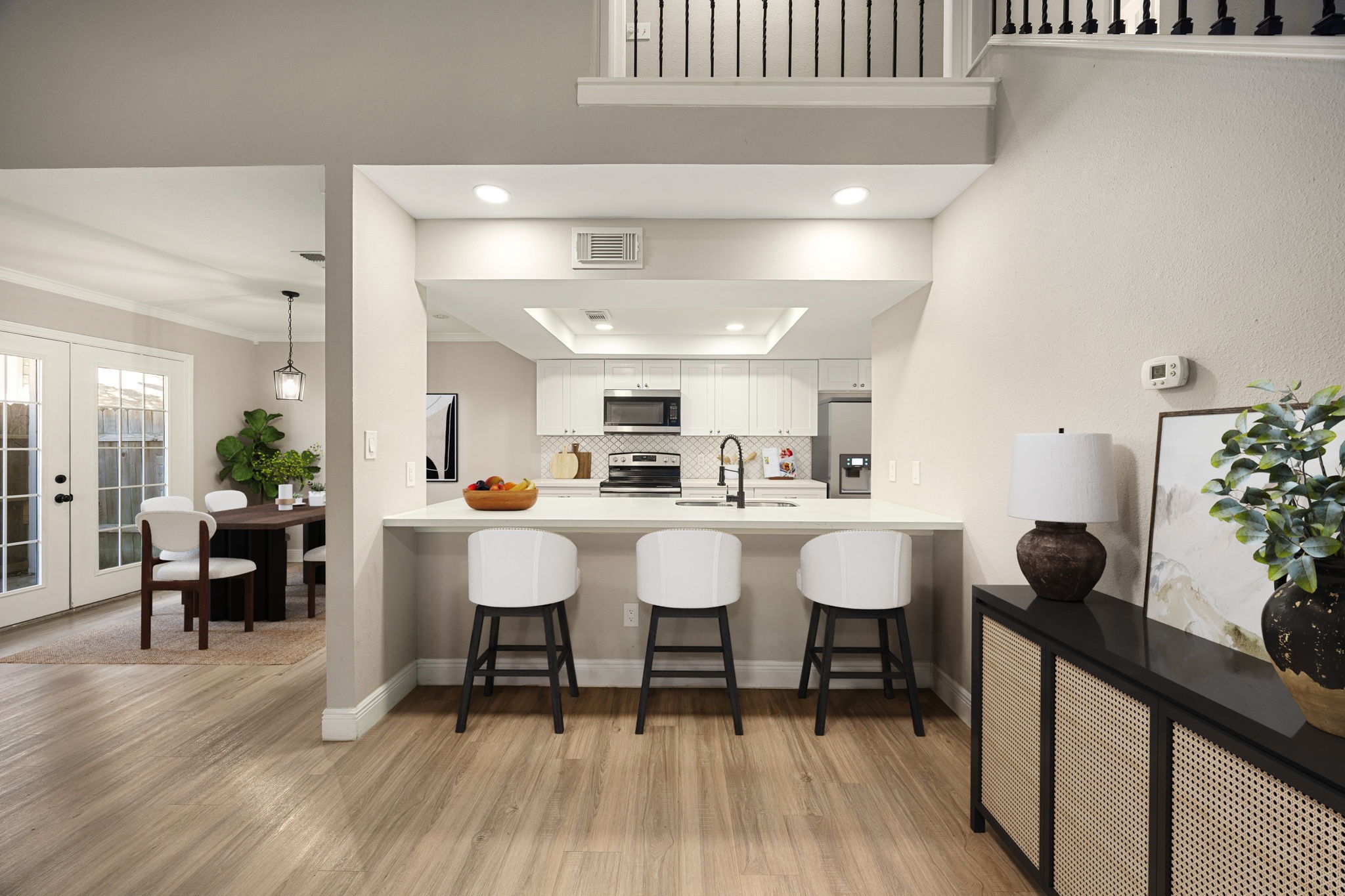 16919 Chapel Pines Drive, Unit 128 Spring, TX 77379 - Photo 7 of 24 The open kitchen and dining area offer excellent flow for everyday living and entertaining, featuring generous counter space, bar seating, and opens into the main living area for a connected, functional layout.