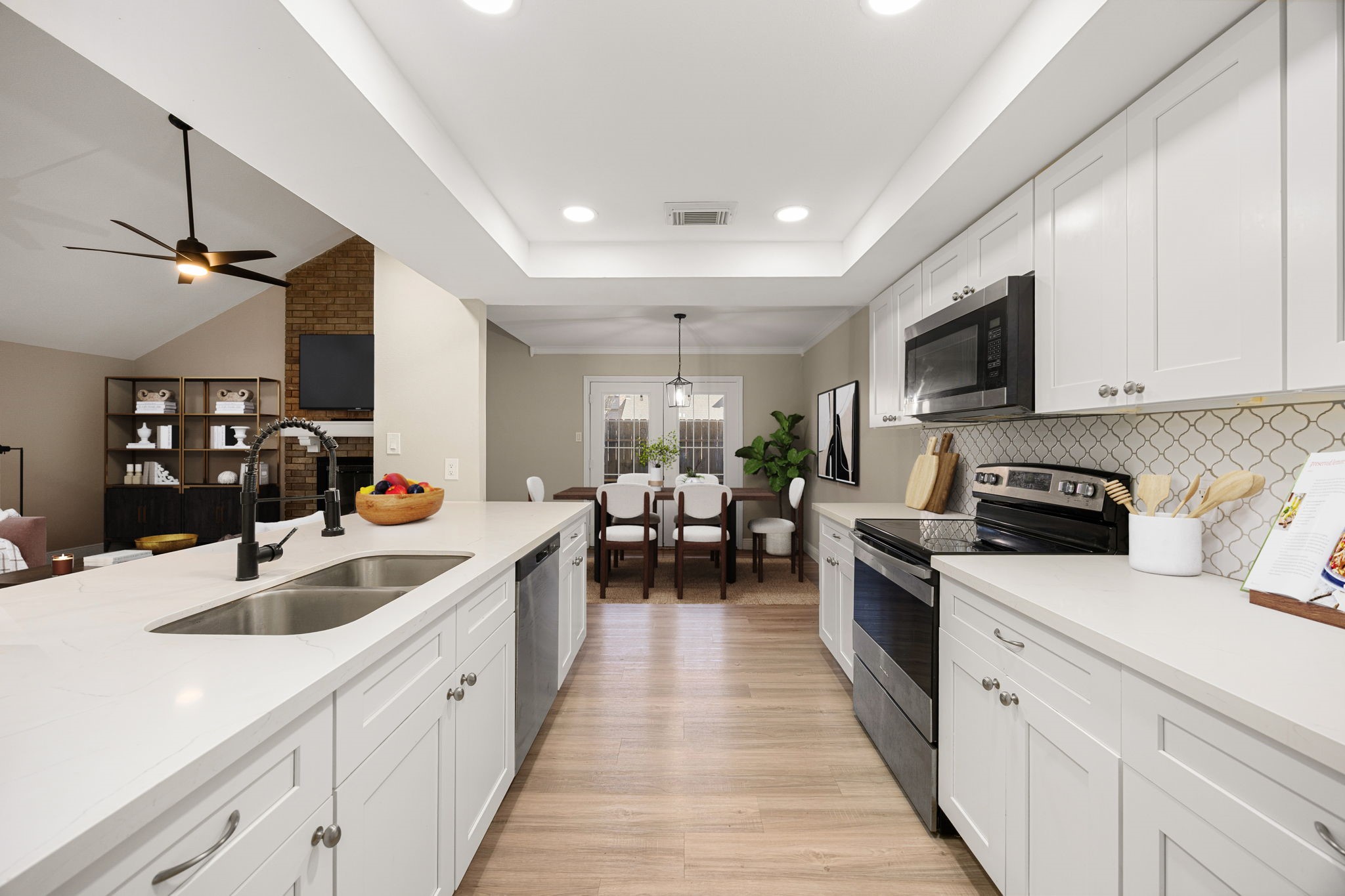 16919 Chapel Pines Drive, Unit 128 Spring, TX 77379 - Photo 9 of 24 A bright, well-designed kitchen offering generous prep space, abundant cabinetry, and a streamlined layout that supports both everyday living and easy entertaining.