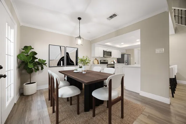 a view of a dining room with furniture