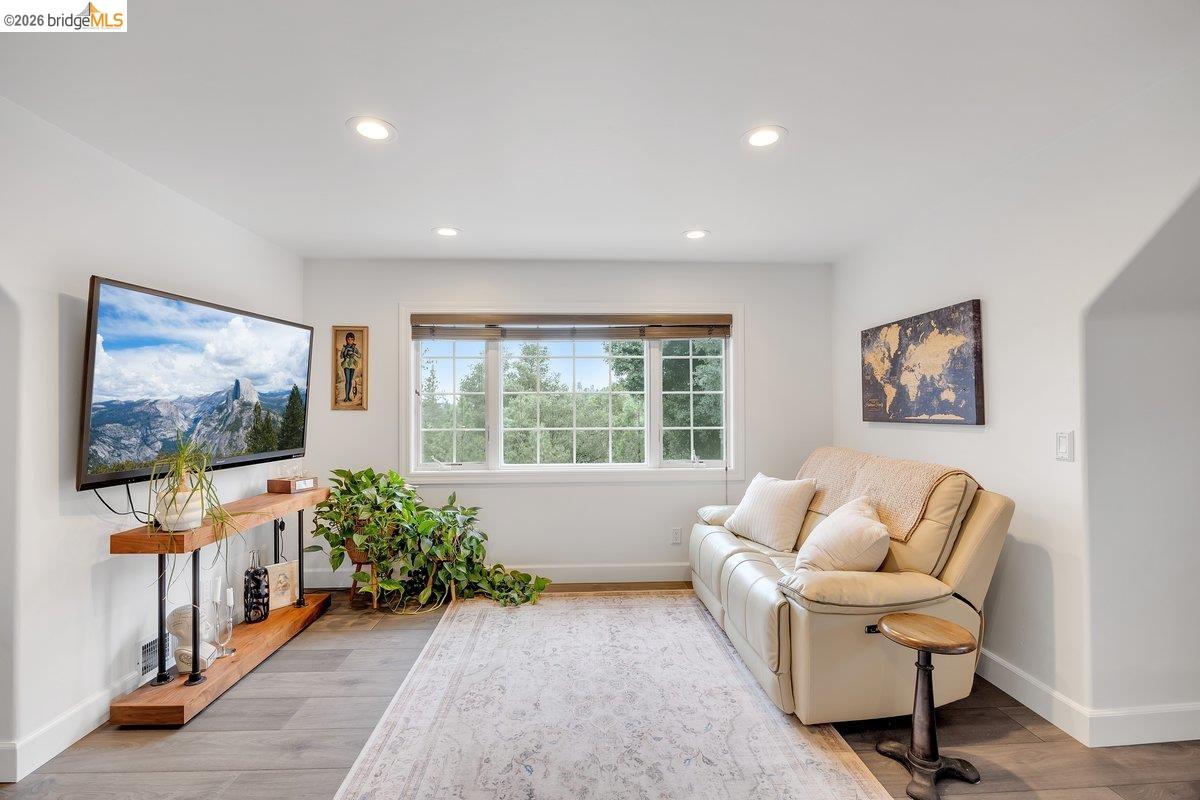 21950 Lyons Bald Mountain Road Sonora, CA 95370 - Photo 38 of 76 a living room with furniture and a flat screen tv