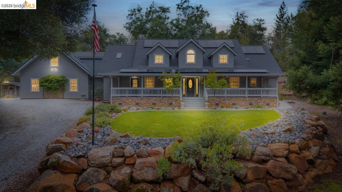 21950 Lyons Bald Mountain Road Sonora, CA 95370 - Photo 4 of 76 a front view of house with a garden