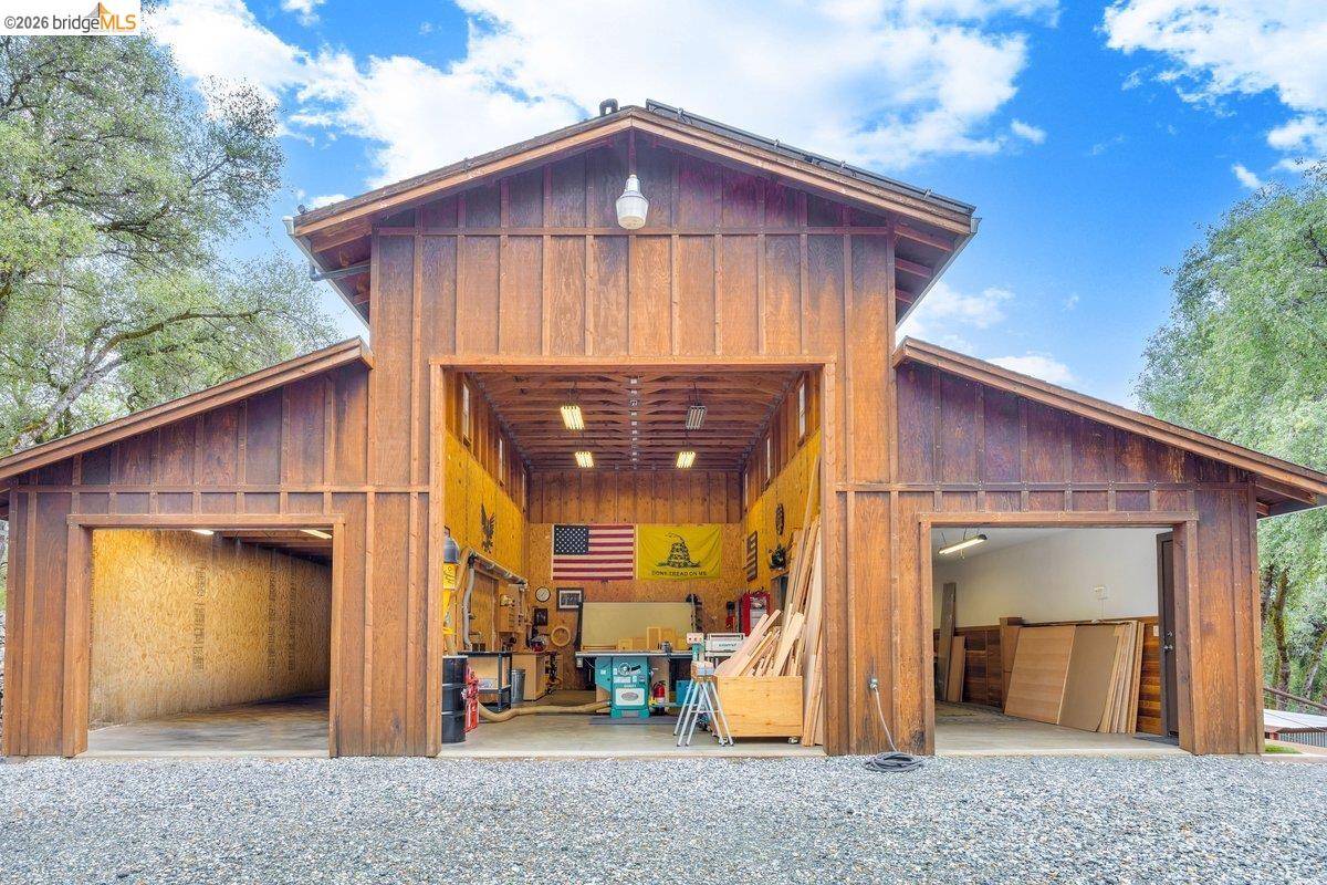 21950 Lyons Bald Mountain Road Sonora, CA 95370 - Photo 49 of 76 a front view of a house with a yard