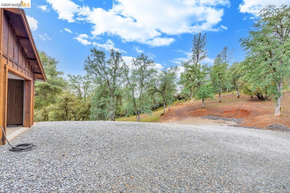 21950 Lyons Bald Mountain Road Sonora, CA 95370 - Photo 51 of 76 a view of a road with a building in the background