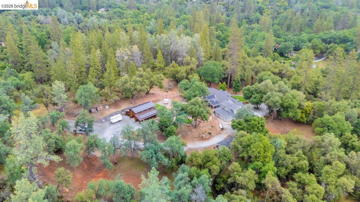 21950 Lyons Bald Mountain Road Sonora, CA 95370 - Photo 73 of 76 an aerial view of residential house with outdoor space and trees around