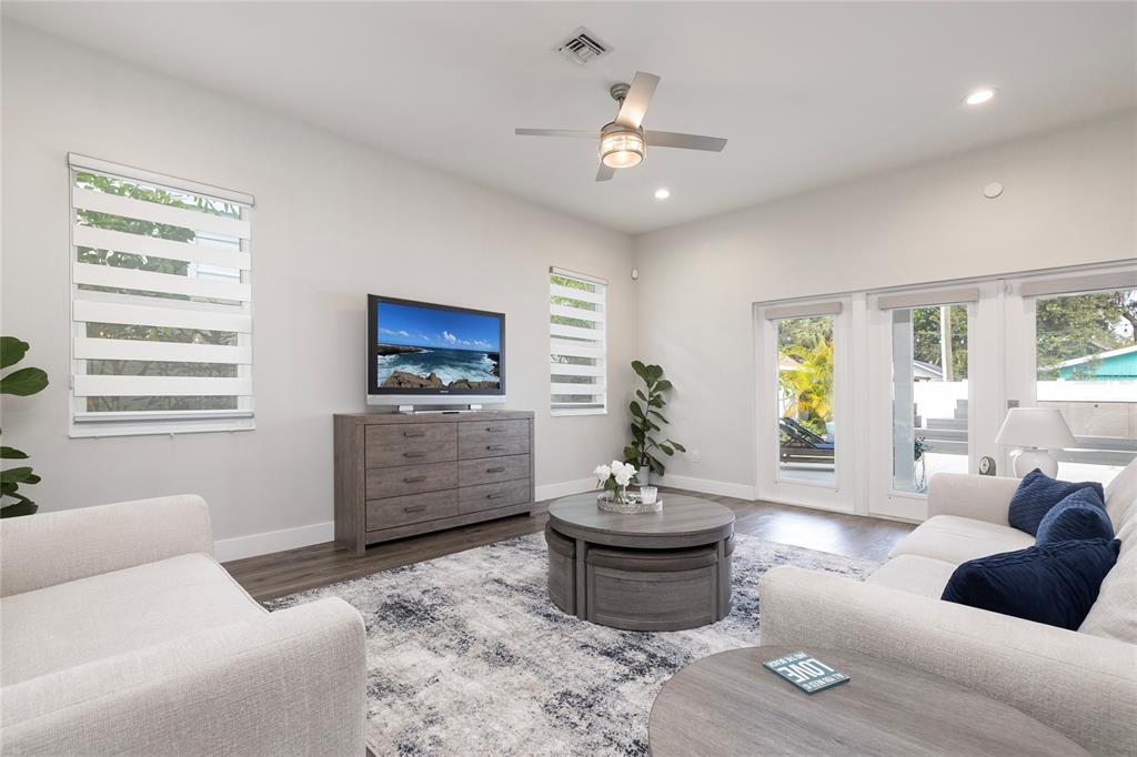 416 Indiana Avenue Crystal Beach, FL 34683 - Photo 21 of 60 a living room with furniture and a flat screen tv