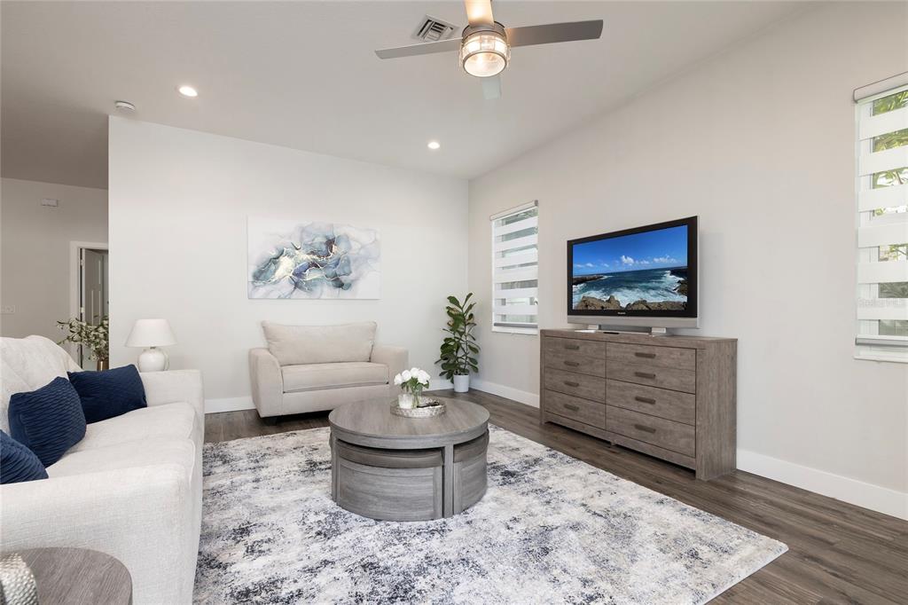 416 Indiana Avenue Crystal Beach, FL 34683 - Photo 22 of 60 a living room with furniture and a flat screen tv