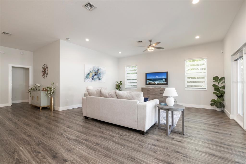 416 Indiana Avenue Crystal Beach, FL 34683 - Photo 25 of 60 a living room with furniture and wooden floor