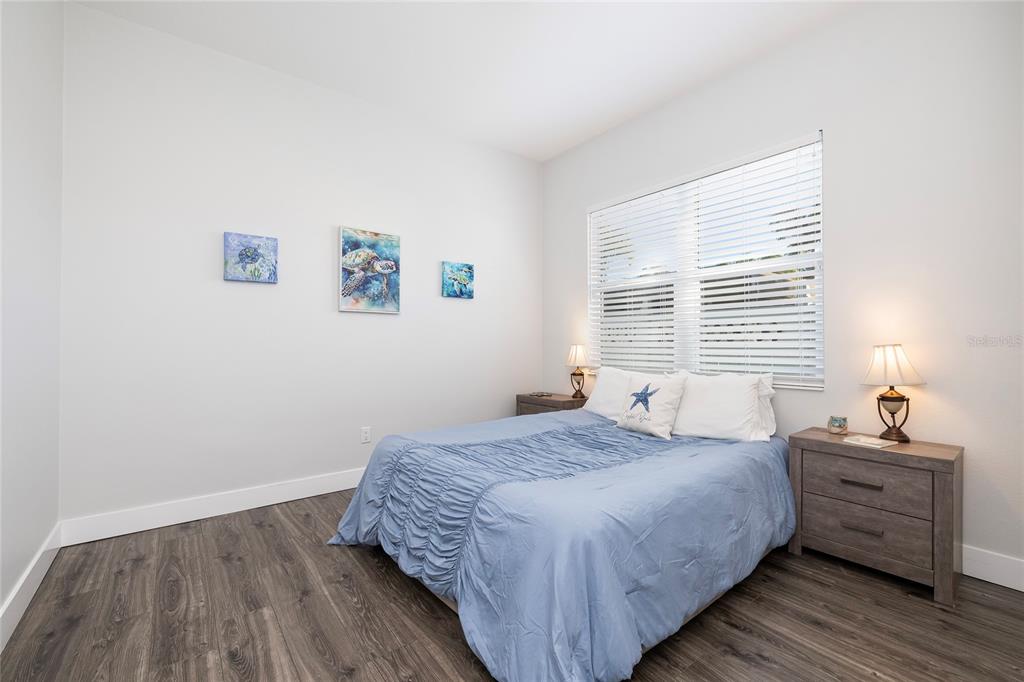 416 Indiana Avenue Crystal Beach, FL 34683 - Photo 28 of 60 a bedroom with a bed and a window