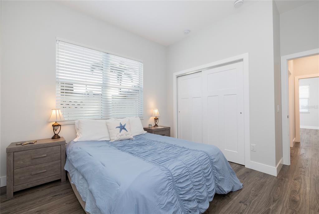 416 Indiana Avenue Crystal Beach, FL 34683 - Photo 29 of 60 a bedroom with a bed and a window