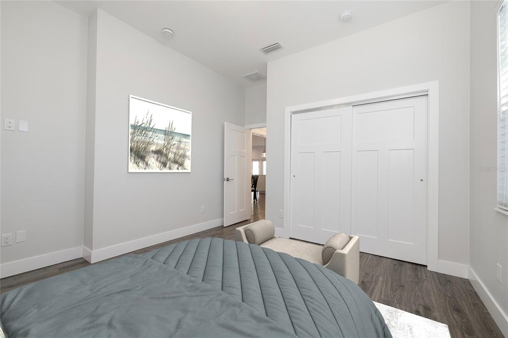 416 Indiana Avenue Crystal Beach, FL 34683 - Photo 31 of 63 an empty room with wooden floor cabinet and windows