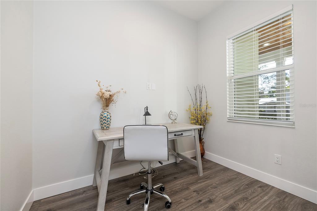 416 Indiana Avenue Crystal Beach, FL 34683 - Photo 32 of 63 a view of a workspace with furniture and a window