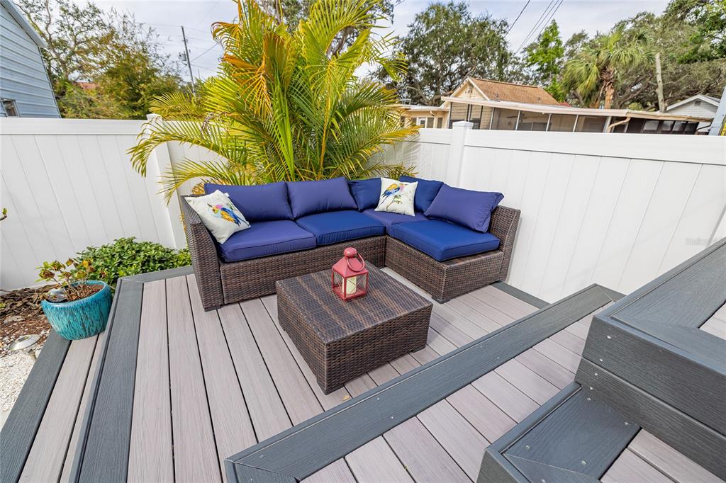 416 Indiana Avenue Crystal Beach, FL 34683 - Photo 38 of 63 a view of a deck with couches and wooden floor