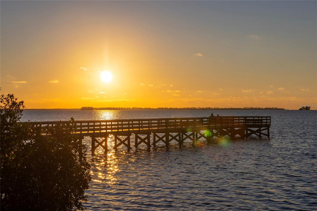416 Indiana Avenue Crystal Beach, FL 34683 - Photo 58 of 63 a view of a lake with houses