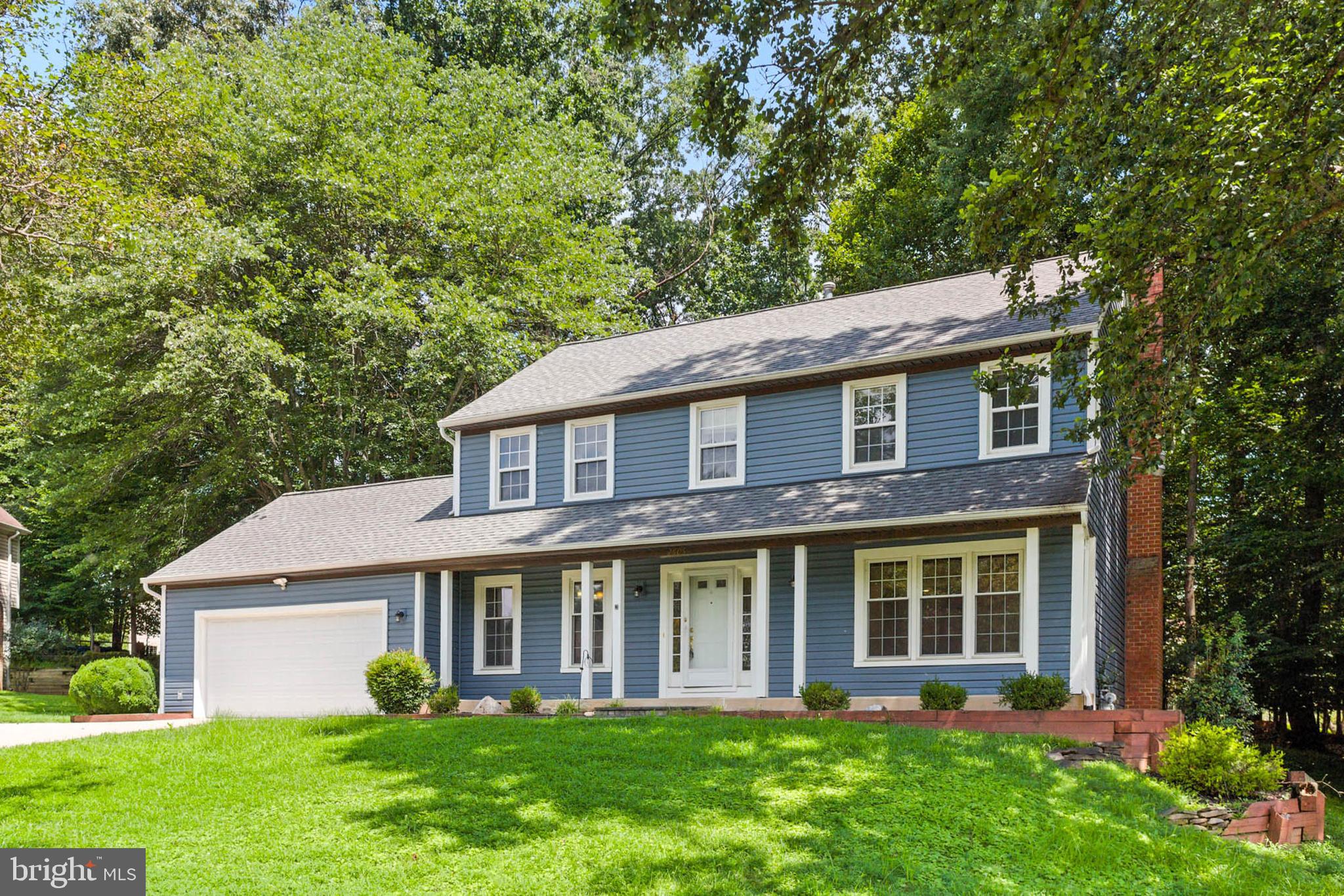 2605 Bainbridge Lane Silver Spring, MD 20906 - Photo 1 of 33 a front view of a house with garden and porch