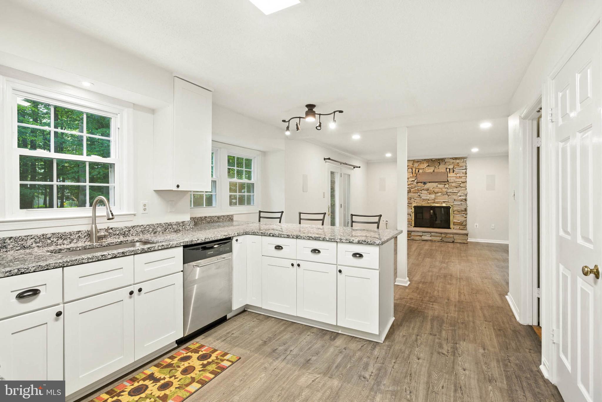 2605 Bainbridge Lane Silver Spring, MD 20906 - Photo 12 of 33 a large white kitchen with a large window