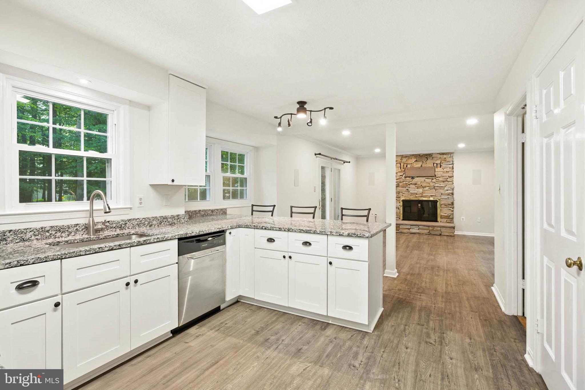 2605 Bainbridge Lane Silver Spring, MD 20906 - Photo 13 of 33 a large white kitchen with a large window