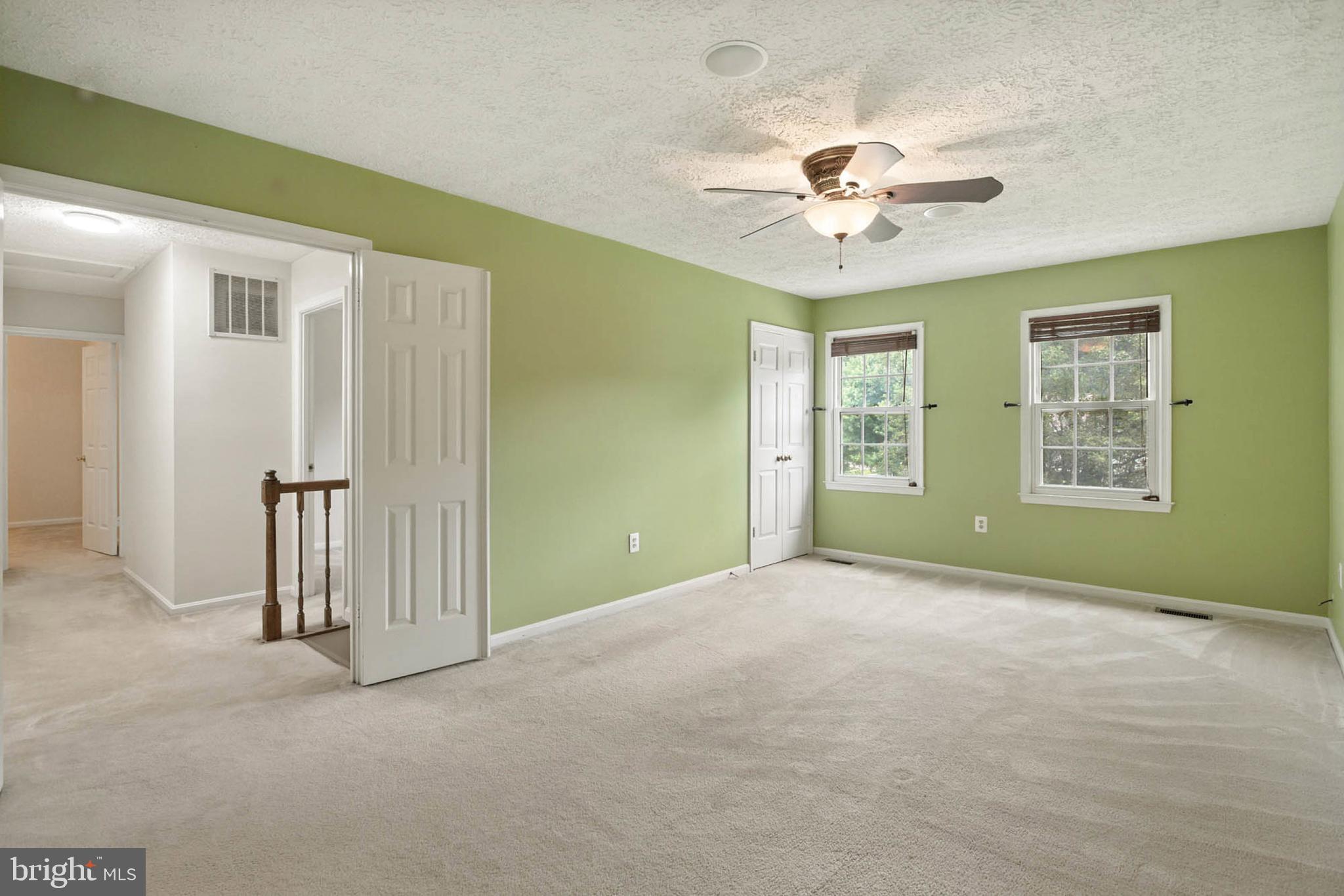 2605 Bainbridge Lane Silver Spring, MD 20906 - Photo 18 of 33 an empty room with windows and fan