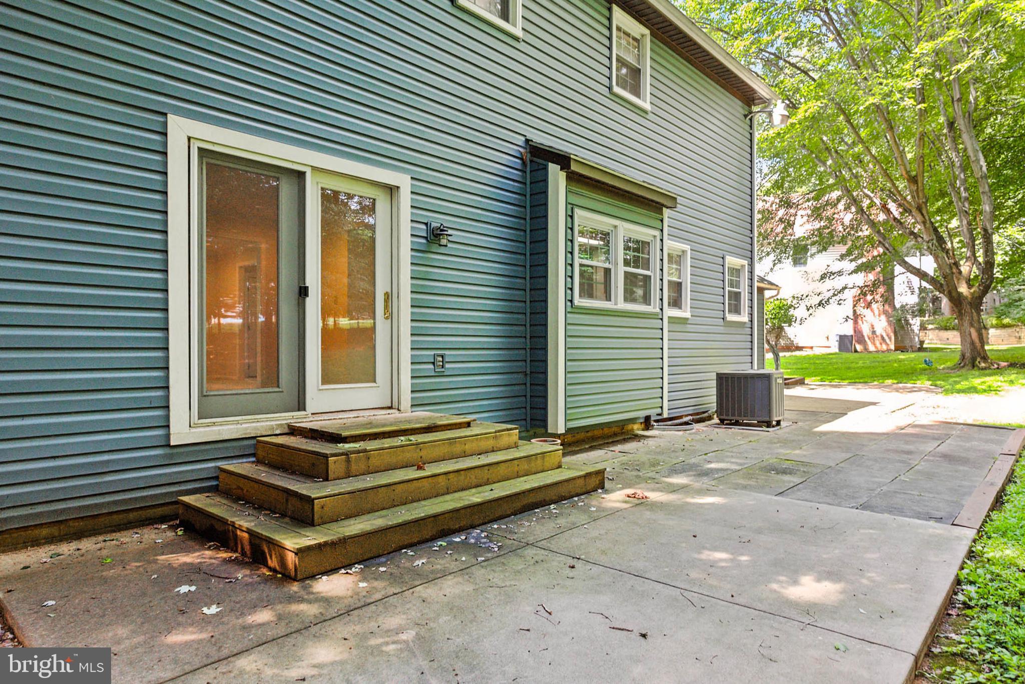 2605 Bainbridge Lane Silver Spring, MD 20906 - Photo 32 of 33 a backyard of a house with barbeque and wooden fence