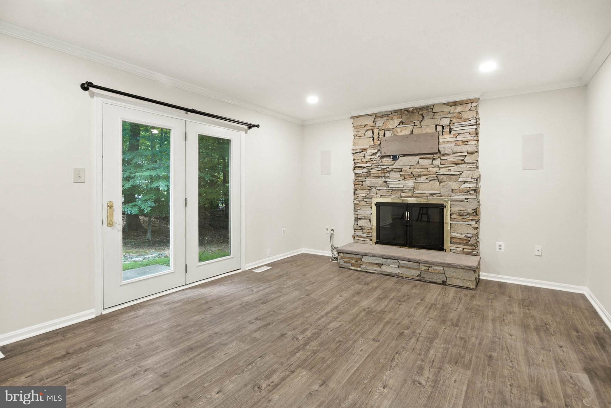 2605 Bainbridge Lane Silver Spring, MD 20906 - Photo 7 of 33 wooden floor fireplace and natural light in room
