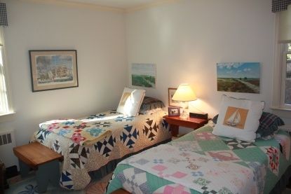 200 Ocean Road Bridgehampton, NY 11932 - Photo 7 of 17 a bedroom with two beds and painting on the wall