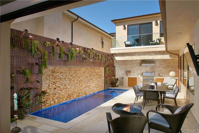 a view of a chairs and table in the patio