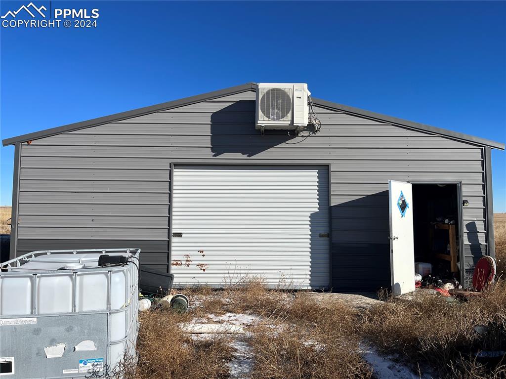 29995 Fred View Road Yoder, CO 80864 - Photo 11 of 12 a view of a house with a garage