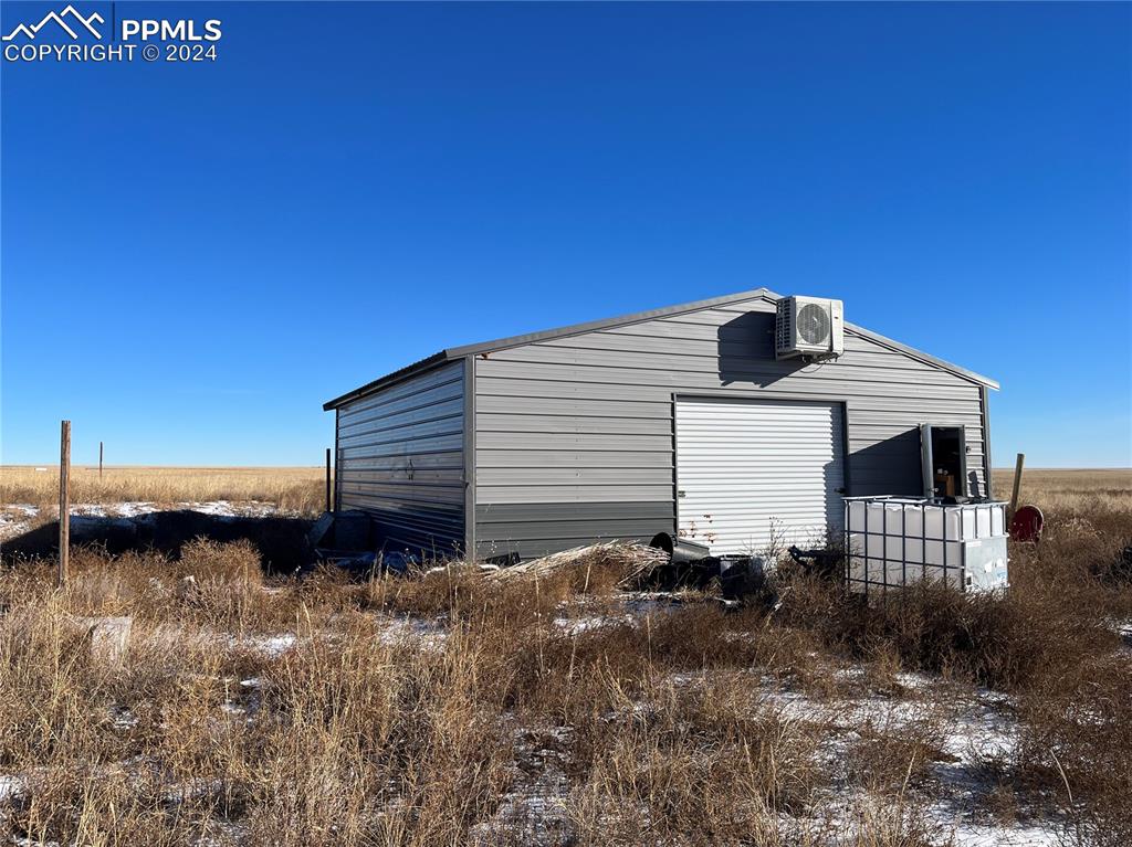 29995 Fred View Road Yoder, CO 80864 - Photo 10 of 12 a backyard of a house with wooden fence