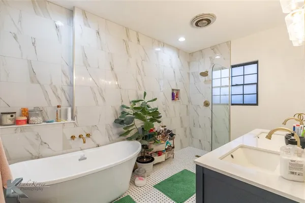 a bathroom with a sink and a bathtub