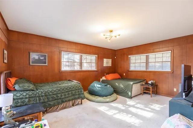 a bedroom with furniture and a window