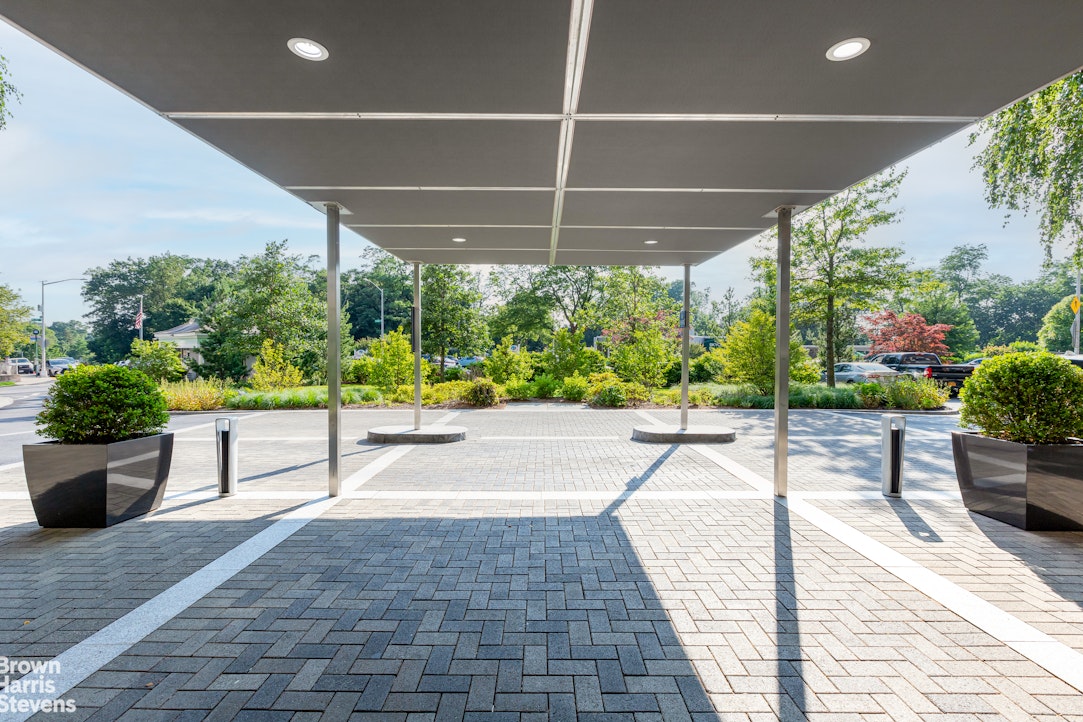 5700 Arlington Avenue, Unit 20S Bronx, NY 10471 - Photo 8 of 15 a lobby with furniture and potted plants