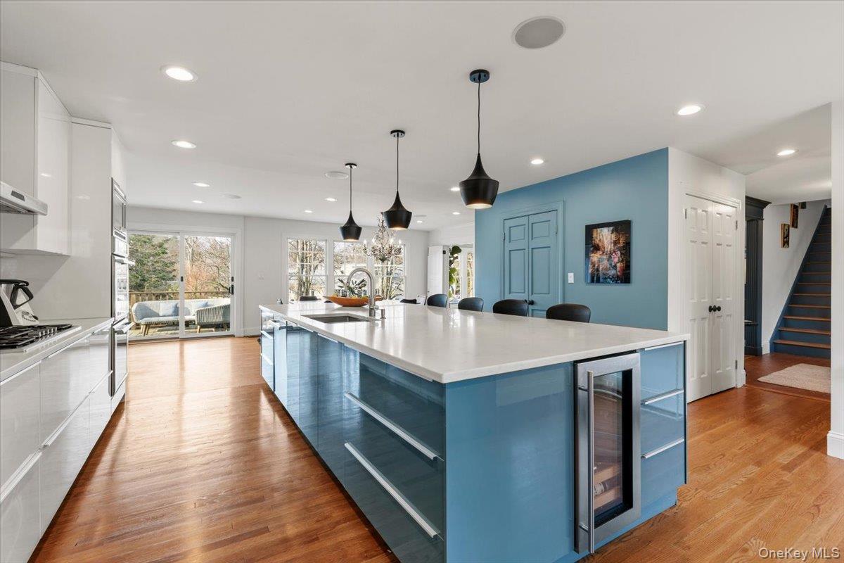 8 Douglas Circle Rye, NY 10580 - Photo 11 of 36 The large central island is stylishly illuminated and offers expansive counter space and bar seating.