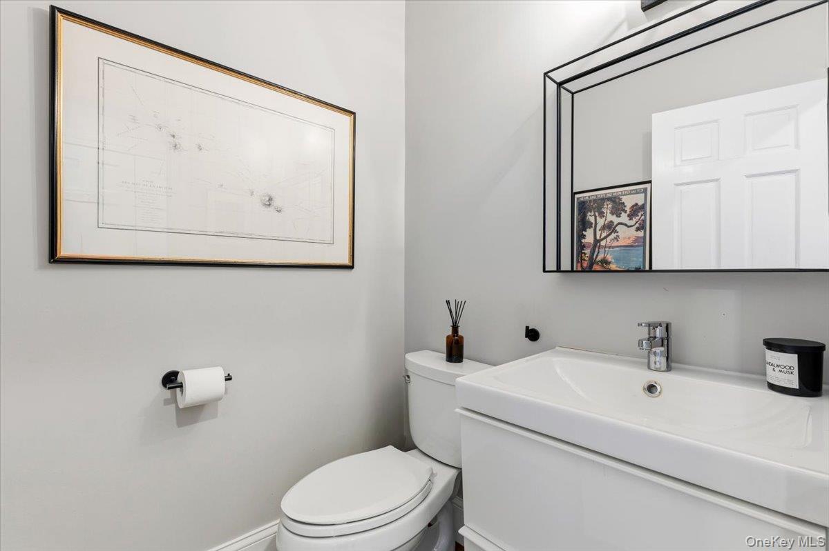 8 Douglas Circle Rye, NY 10580 - Photo 14 of 36 The added powder room is well situated and appointed.